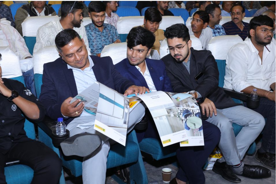 Munshi Interior leadership reviewing the new product catalogue at the DecorPlast dealer meet