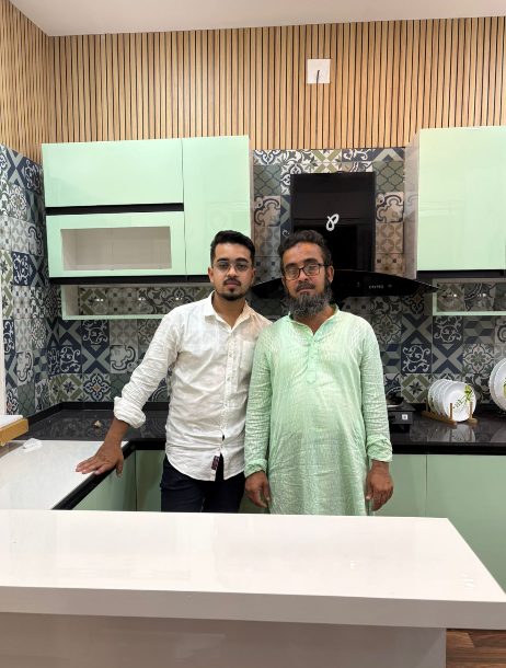 The founders of Munshi Interior at a completed modular kitchen project