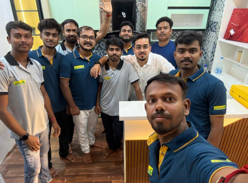 The Munshi Interior team taking a selfie at a completed showroom project
